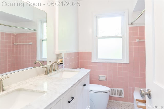 2856 Central St, Berkley, MI 48072 - full bath with tile walls, double vanity, a shower, tile patterned floors, and a wainscoted wall