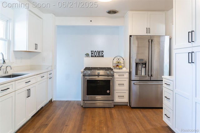 2856 Central St, Berkley, MI 48072 - kitchen featuring appliances with stainless steel finishes, dark wood-style flooring, light countertops, and white cabinets