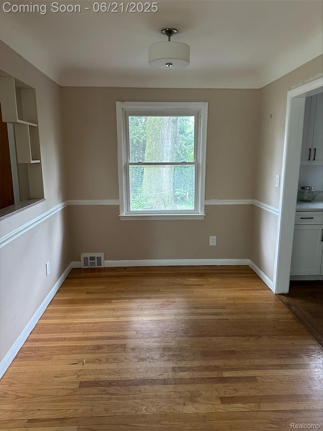 2856 Central St, Berkley, MI 48072 - spare room featuring wood finished floors