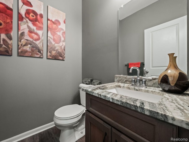 2500 Normandy Rd Unit 41, Royal Oak, MI 48073 - bathroom with vanity, toilet, wood finished floors, and baseboards
