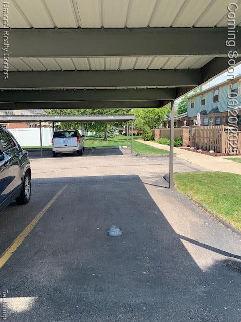 2041 N Arbor Way Dr Unit 71, Canton, MI 48188 - garage featuring covered parking