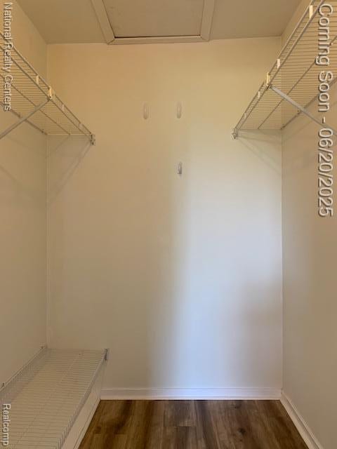 2041 N Arbor Way Dr Unit 71, Canton, MI 48188 - walk in closet featuring dark wood finished floors and attic access