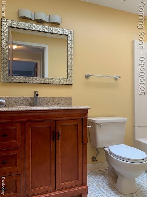 2041 N Arbor Way Dr Unit 71, Canton, MI 48188 - bathroom featuring vanity, a tub, and tile patterned flooring