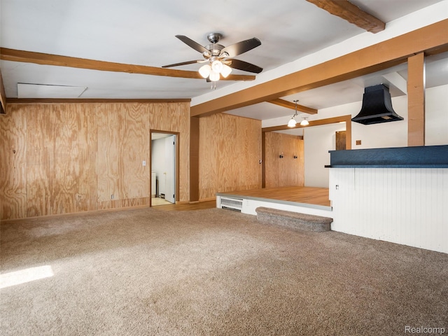 28212 Shock St, Saint Clair Shores, MI 48081 - unfurnished living room with beam ceiling, wood walls, ceiling fan, and carpet floors