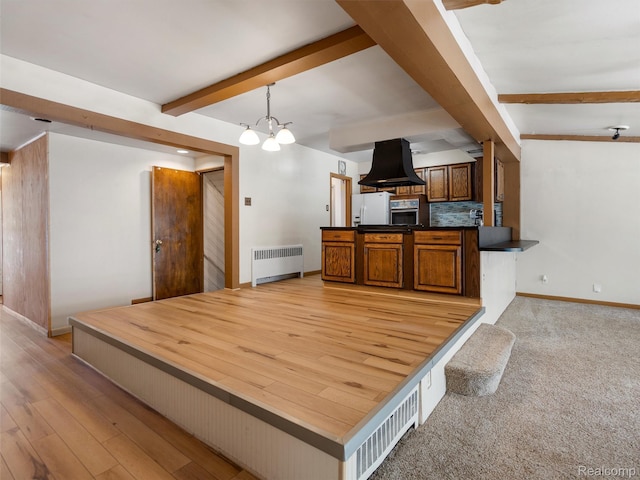 28212 Shock St, Saint Clair Shores, MI 48081 - unfurnished dining area with radiator, beam ceiling, a chandelier, and light wood-style flooring