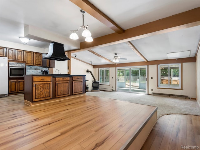28212 Shock St, Saint Clair Shores, MI 48081 - kitchen with stainless steel oven, open floor plan, freestanding refrigerator, and dark countertops