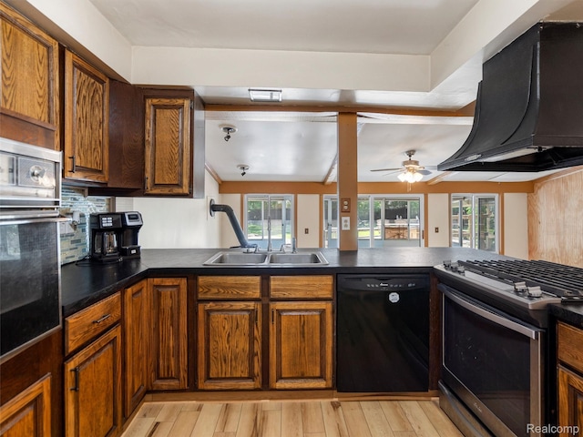 28212 Shock St, Saint Clair Shores, MI 48081 - kitchen featuring stainless steel appliances, ventilation hood, dark countertops, and light wood-type flooring