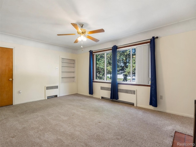 28212 Shock St, Saint Clair Shores, MI 48081 - carpeted empty room with radiator and a ceiling fan
