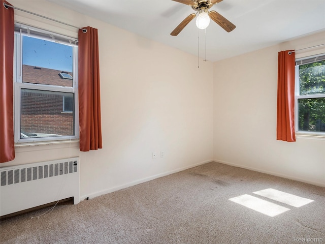 28212 Shock St, Saint Clair Shores, MI 48081 - unfurnished room with radiator, carpet floors, and ceiling fan