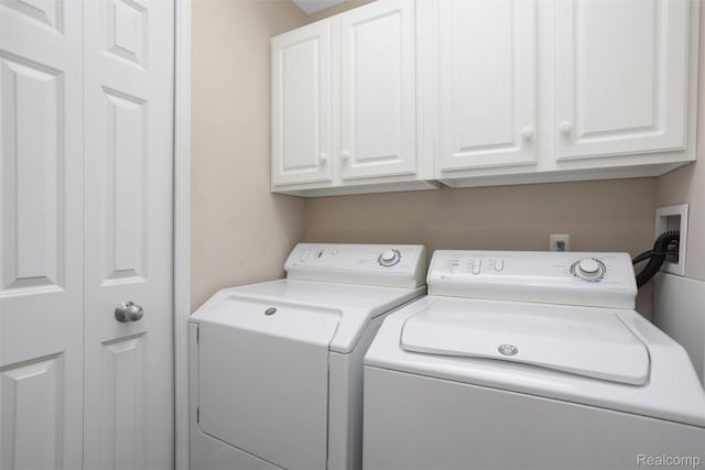6532 Turtle Walk, Clarkston, MI 48346 - laundry area featuring cabinet space and washer and dryer