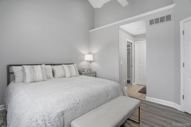 6532 Turtle Walk, Clarkston, MI 48346 - bedroom featuring baseboards, wood finished floors, and ceiling fan