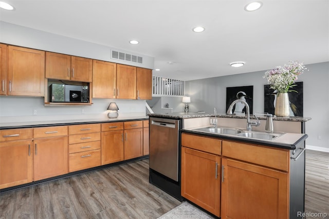 6532 Turtle Walk, Clarkston, MI 48346 - kitchen with stainless steel dishwasher, a sink, black microwave, light wood-type flooring, and recessed lighting