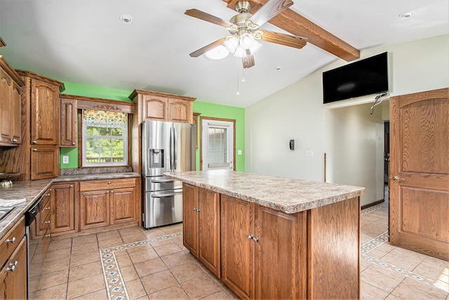 14894 L Dr N, Marshall, MI 49068 - kitchen with appliances with stainless steel finishes, a kitchen island, light tile patterned flooring, a ceiling fan, and brown cabinetry