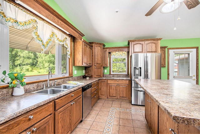 14894 L Dr N, Marshall, MI 49068 - kitchen featuring appliances with stainless steel finishes, a sink, plenty of natural light, and light tile patterned flooring