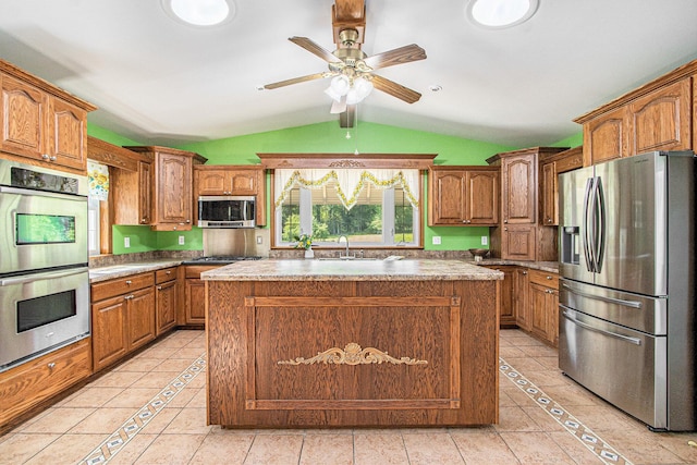 14894 L Dr N, Marshall, MI 49068 - kitchen with stainless steel appliances, lofted ceiling, light tile patterned floors, ceiling fan, and a sink