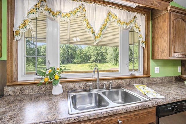 14894 L Dr N, Marshall, MI 49068 - kitchen with dishwasher, a sink, brown cabinets, and dark countertops