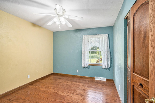 14894 L Dr N, Marshall, MI 49068 - unfurnished room with wood finished floors, ceiling fan, and baseboards
