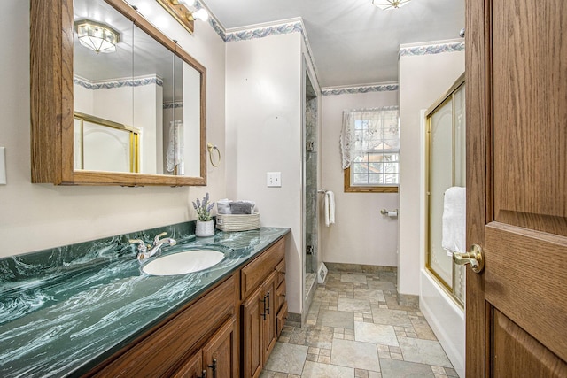 14894 L Dr N, Marshall, MI 49068 - full bathroom with stone finish floors, an enclosed shower, vanity, baseboards, and a tub to relax in