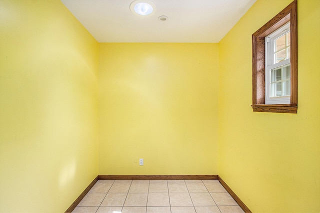 14894 L Dr N, Marshall, MI 49068 - spare room featuring baseboards and light tile patterned flooring