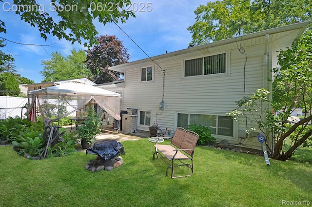 43475 Deborah Dr, Sterling Heights, MI 48313 - back of house featuring a gazebo and an outdoor fire pit