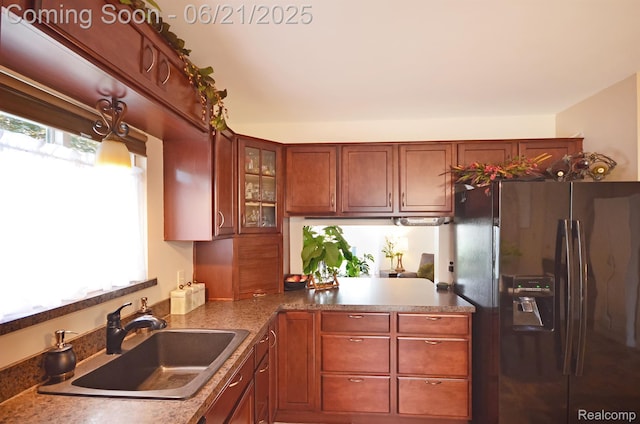 43475 Deborah Dr, Sterling Heights, MI 48313 - kitchen with refrigerator with ice dispenser, glass insert cabinets, a peninsula, and brown cabinets