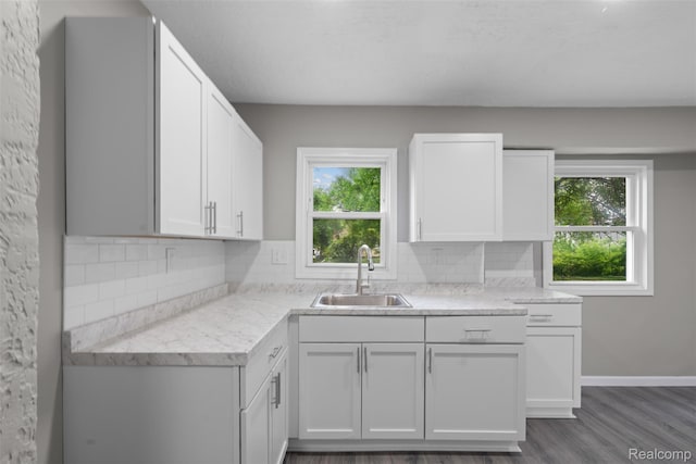 26908 Kitch St, Inkster, MI 48141 - kitchen with a sink, decorative backsplash, white cabinets, dark wood finished floors, and baseboards