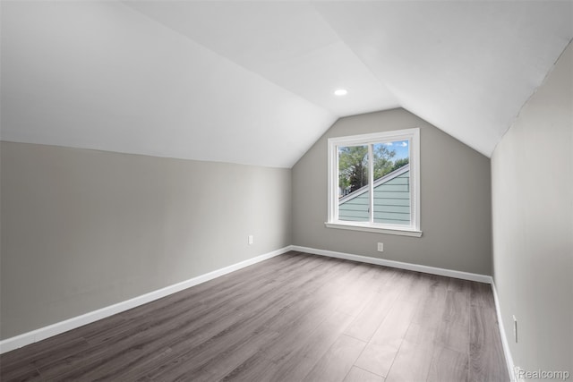 26908 Kitch St, Inkster, MI 48141 - additional living space with dark wood-style floors, lofted ceiling, baseboards, and recessed lighting
