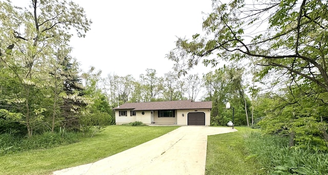 2122 Houser Rd, Holly, MI 48442 - ranch-style house with driveway, a garage, and a front lawn