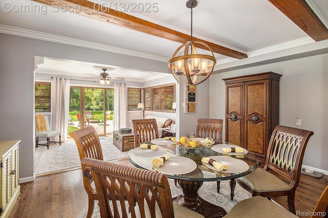 9875 Island Dr, Grosse Ile, MI 48138 - dining room featuring crown molding, a chandelier, baseboards, wood finished floors, and ceiling fan