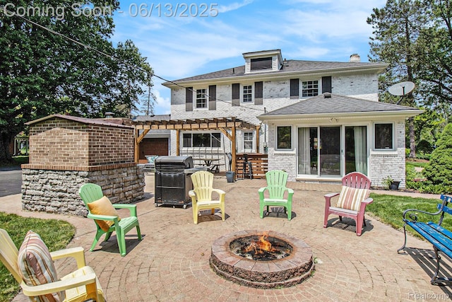 9875 Island Dr, Grosse Ile, MI 48138 - back of property with a fire pit, a pergola, a patio area, brick siding, and a chimney