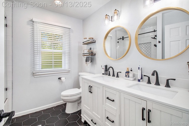 9875 Island Dr, Grosse Ile, MI 48138 - bathroom featuring double vanity, toilet, tiled shower, tile patterned flooring, and baseboards