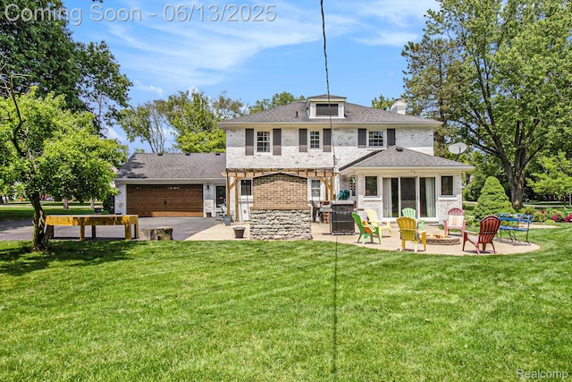 9875 Island Dr, Grosse Ile, MI 48138 - back of property with a fire pit, a garage, a lawn, a chimney, and brick siding