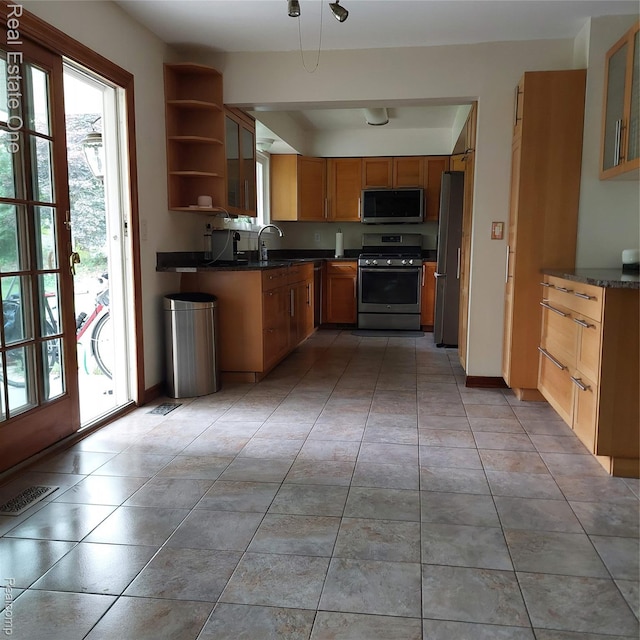 5208 Woodview Dr, Bloomfield Hills, MI 48302 - kitchen with appliances with stainless steel finishes, plenty of natural light, dark countertops, and open shelves