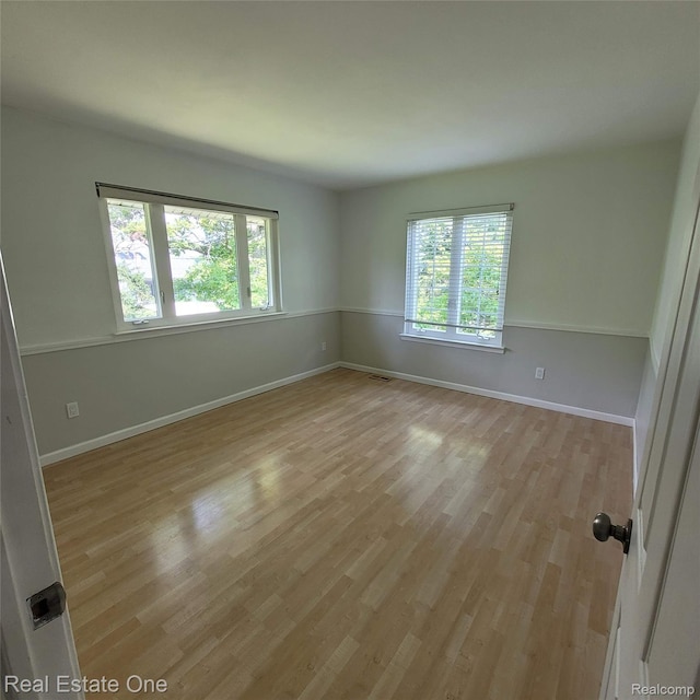 5208 Woodview Dr, Bloomfield Hills, MI 48302 - empty room with light wood finished floors and baseboards