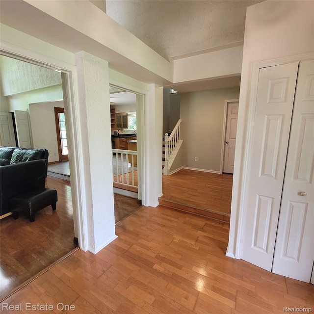 5208 Woodview Dr, Bloomfield Hills, MI 48302 - hall featuring light wood-style flooring and stairway