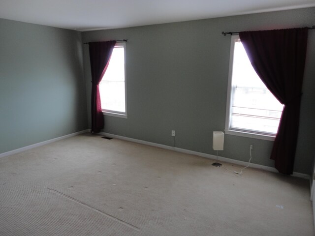 2856 Barclay Way, Ann Arbor, MI 48105 - empty room with plenty of natural light, carpet floors, and baseboards