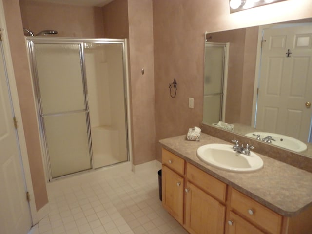 2856 Barclay Way, Ann Arbor, MI 48105 - full bath featuring a stall shower, vanity, tile patterned flooring, and baseboards