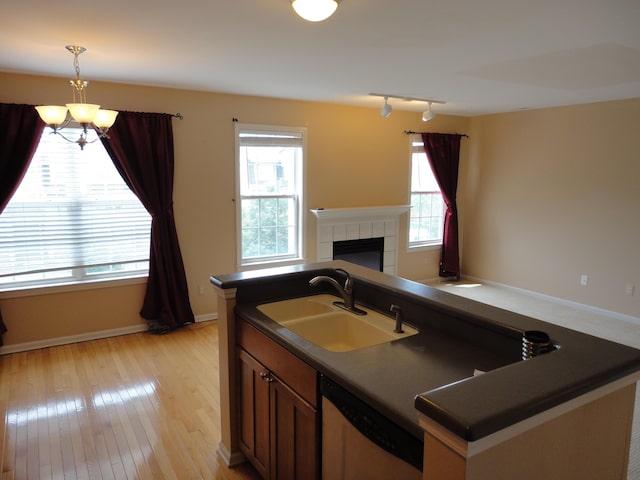 2856 Barclay Way, Ann Arbor, MI 48105 - kitchen with stainless steel dishwasher, a chandelier, a sink, and dark countertops