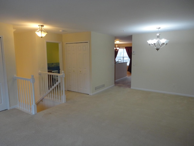 2856 Barclay Way, Ann Arbor, MI 48105 - empty room featuring a chandelier, carpet floors, and baseboards