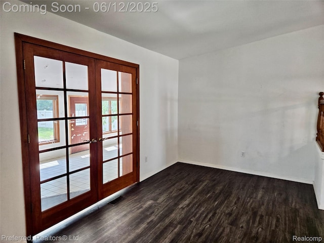 9498 Bassett St, Livonia, MI 48150 - empty room featuring french doors, baseboards, and dark wood finished floors