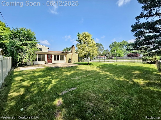 9498 Bassett St, Livonia, MI 48150 - fenced backyard with a patio area