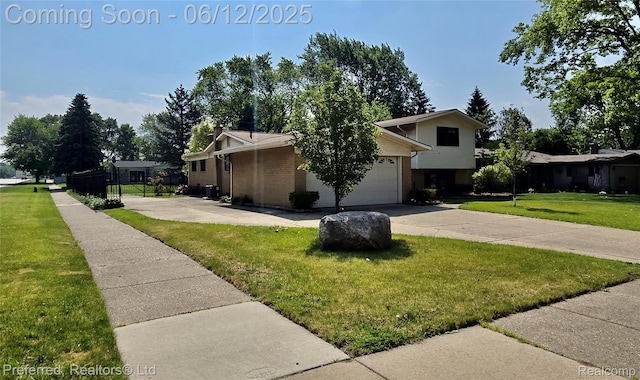 9498 Bassett St, Livonia, MI 48150 - view of side of home featuring driveway, a yard, an attached garage, and brick siding
