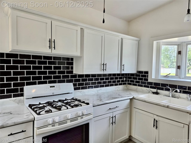 9498 Bassett St, Livonia, MI 48150 - kitchen featuring white range with gas stovetop, white cabinets, backsplash, and light stone countertops
