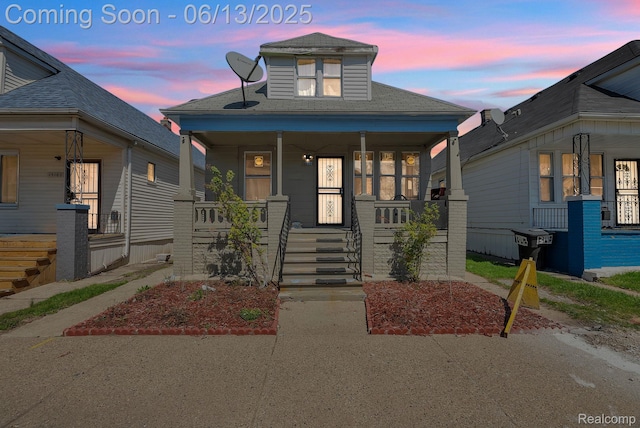13154 Klinger St, Hamtramck, MI 48212 - view of front facade with covered porch and roof with shingles