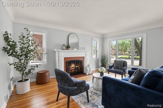 1630 N Denwood St, Dearborn, MI 48128 - living room with wood finished floors and a brick fireplace