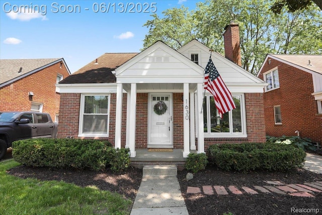 1630 N Denwood St, Dearborn, MI 48128 - view of front of home with brick siding and a chimney