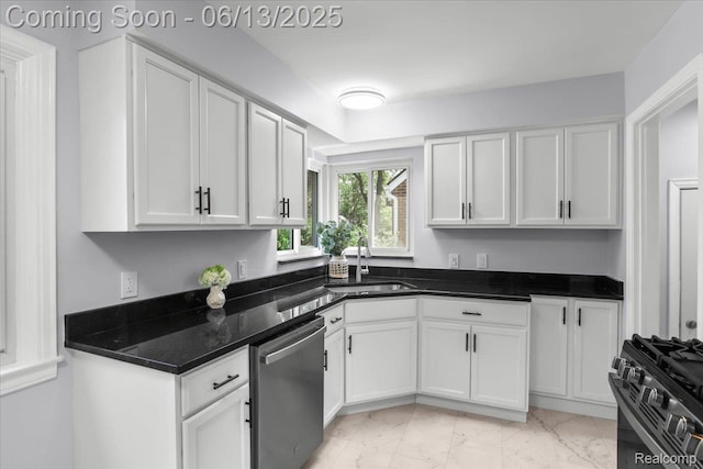 1630 N Denwood St, Dearborn, MI 48128 - kitchen with stainless steel dishwasher, black gas range oven, white cabinetry, and light marble finish flooring