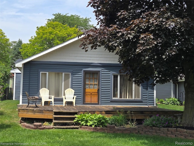 8991 Lakeview Dr, White Lake, MI 48386 - back of house with a wooden deck