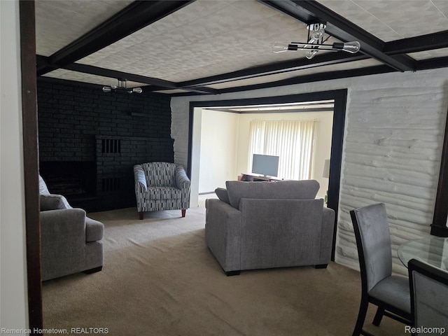8991 Lakeview Dr, White Lake, MI 48386 - carpeted living room with beam ceiling and a fireplace
