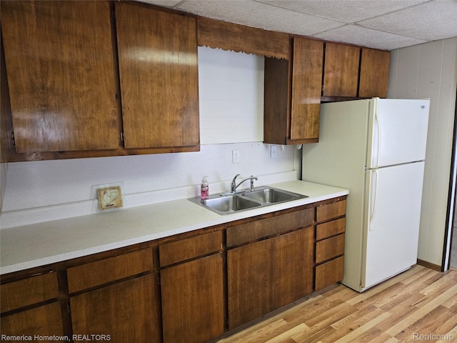 8991 Lakeview Dr, White Lake, MI 48386 - kitchen featuring freestanding refrigerator, light countertops, and light wood-type flooring